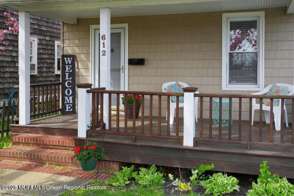 612 Sylvania Avenue Avon-by-the-Sea, NJ 07717 - Photo 6 of 17 a view of a house with a small yard