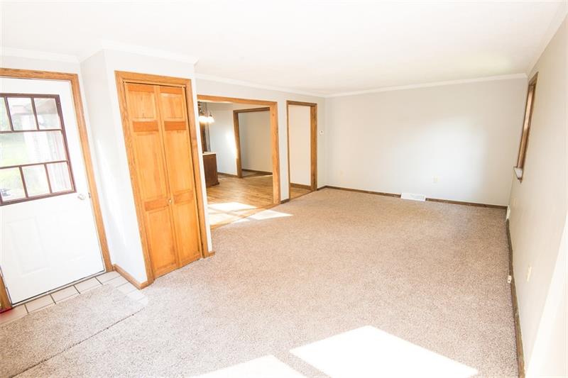 85 McClure Road Cheswick, PA 15024 - Photo 2 of 25 Large living room with new carpet and fresh paint!