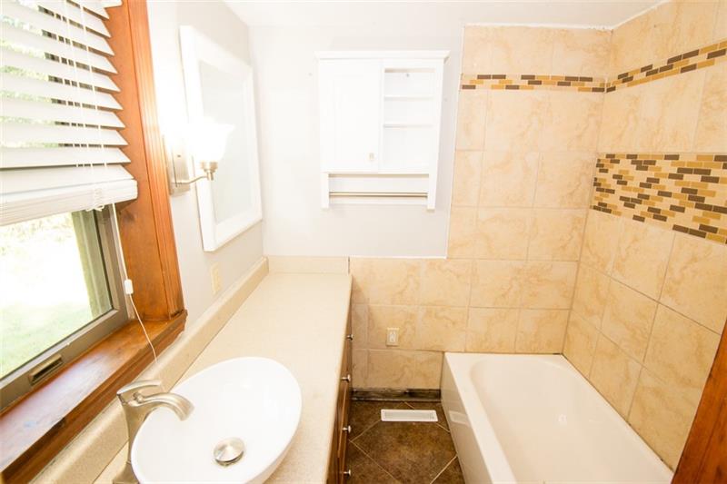 85 McClure Road Cheswick, PA 15024 - Photo 14 of 25 Main hall bath has been remodeled recently with ceramic!