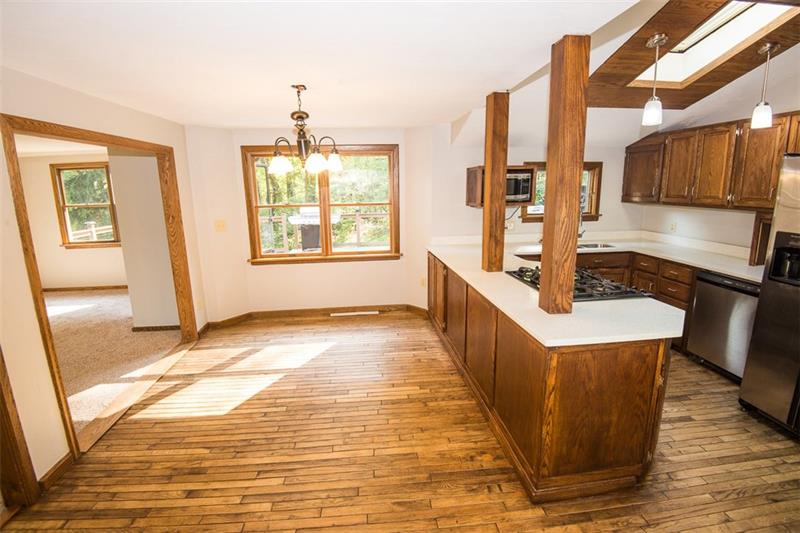 85 McClure Road Cheswick, PA 15024 - Photo 6 of 25 View of dining area with hardwood flooring.