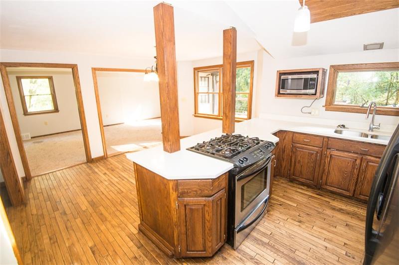 85 McClure Road Cheswick, PA 15024 - Photo 7 of 25 Kitchen opens up to the dining room and living room offering you to entertain and cook at the same time.