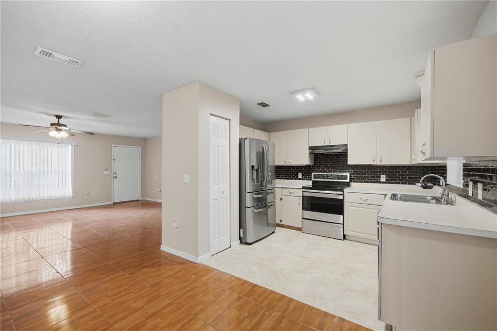14 Cedar Tree Terrace Ocala, FL 34472 - Photo 13 of 32 a kitchen with a refrigerator stove and sink