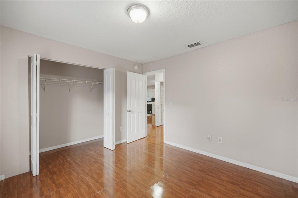 14 Cedar Tree Terrace Ocala, FL 34472 - Photo 22 of 32 a view of an empty room with wooden floor and closet