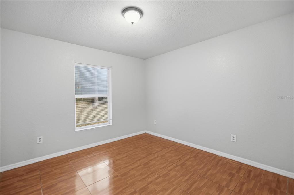 14 Cedar Tree Terrace Ocala, FL 34472 - Photo 24 of 32 an empty room with a window