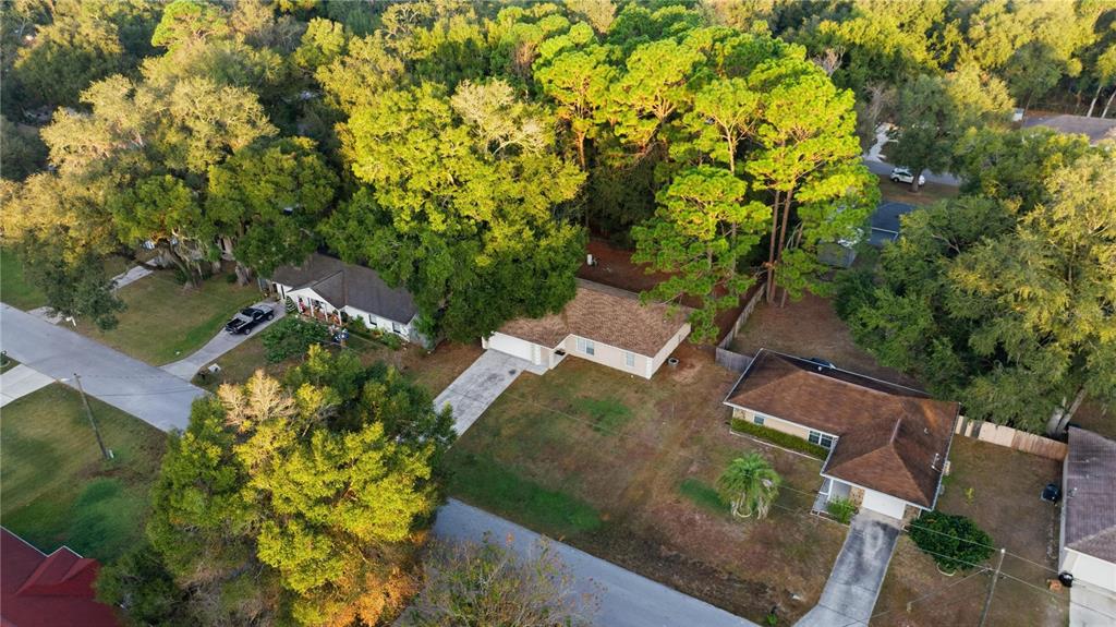14 Cedar Tree Terrace Ocala, FL 34472 - Photo 29 of 32 an aerial view of a house with a yard