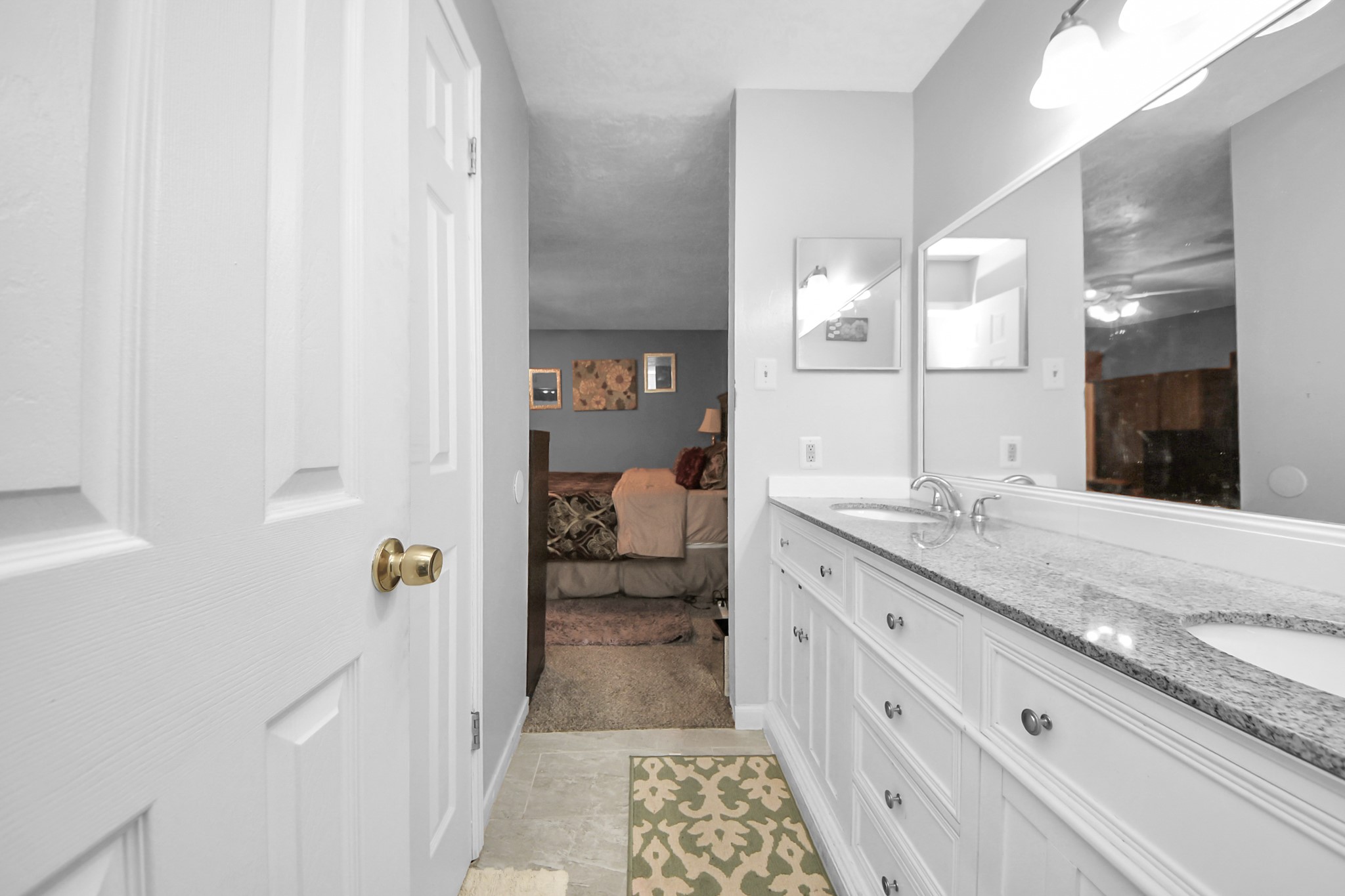 4155 Amir Street Houston, TX 77072 - Photo 39 of 43 a spacious bathroom with a granite countertop sink and mirror