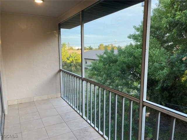 a view of balcony with yard