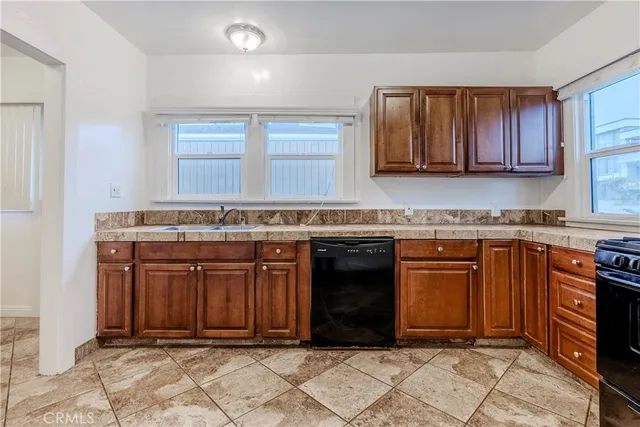 a kitchen with stainless steel appliances and cabinets