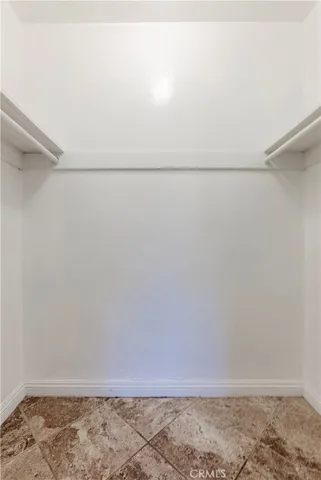 a view of storage and utility room with washer and dryer