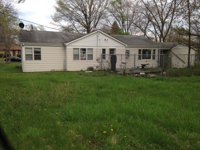 2128 Beechnut Road Northbrook, IL 60062 - Photo 7 of 8 a view of house with a big yard potted plants and large tree