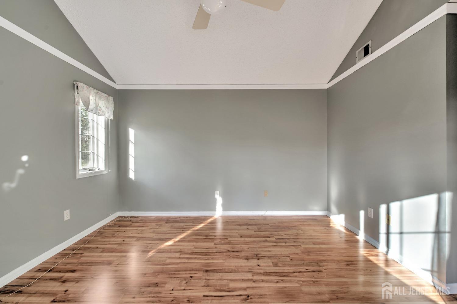 30 Winthrop Road Monroe Township, NJ 08831 - Photo 20 of 42 a view of empty room with wooden floor and fan