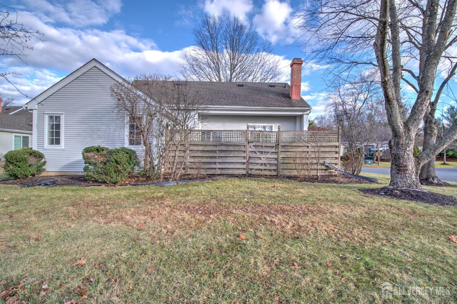 30 Winthrop Road Monroe Township, NJ 08831 - Photo 3 of 42 a view of a house with a fence and a tree