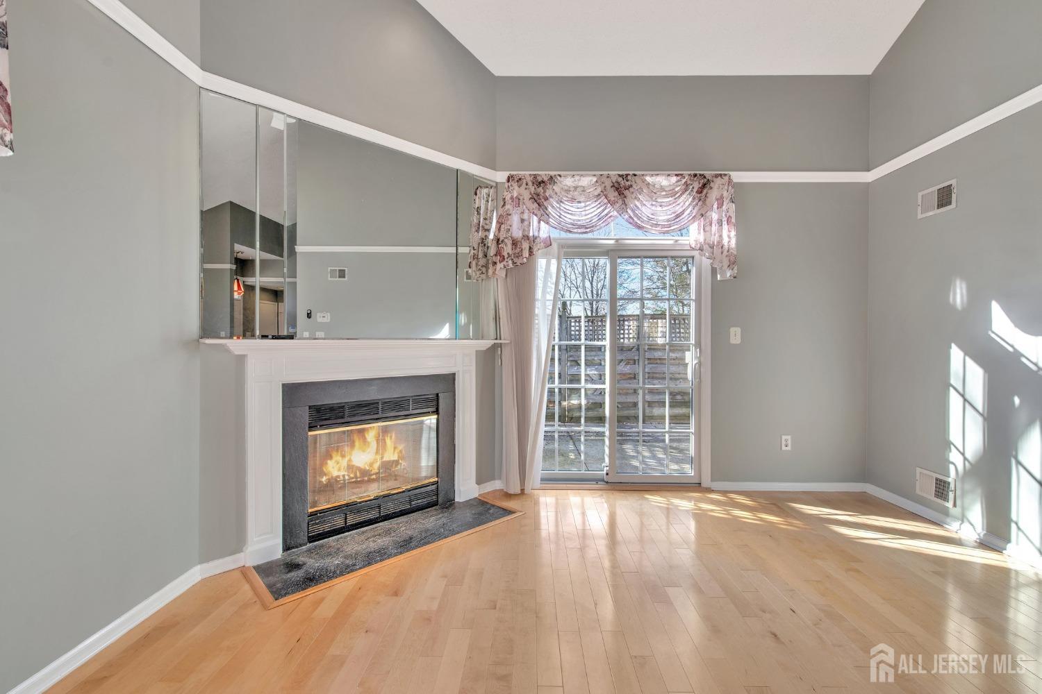 30 Winthrop Road Monroe Township, NJ 08831 - Photo 8 of 42 a view of an empty room with a fireplace and a window
