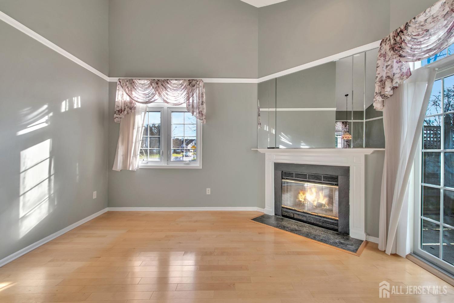 30 Winthrop Road Monroe Township, NJ 08831 - Photo 10 of 42 a view of an empty room with a fireplace and window