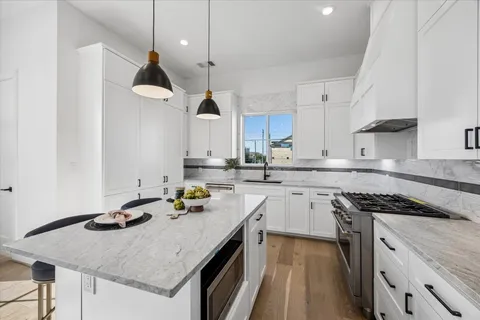 a bathroom with a tub a window and a shower