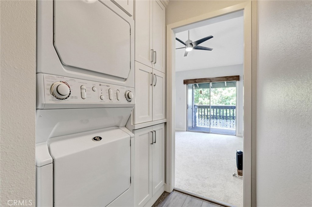 7890 East Spring Street, Unit 23H Long Beach, CA 90815 - Photo 28 of 39 Hallway with built-in storage and laundry