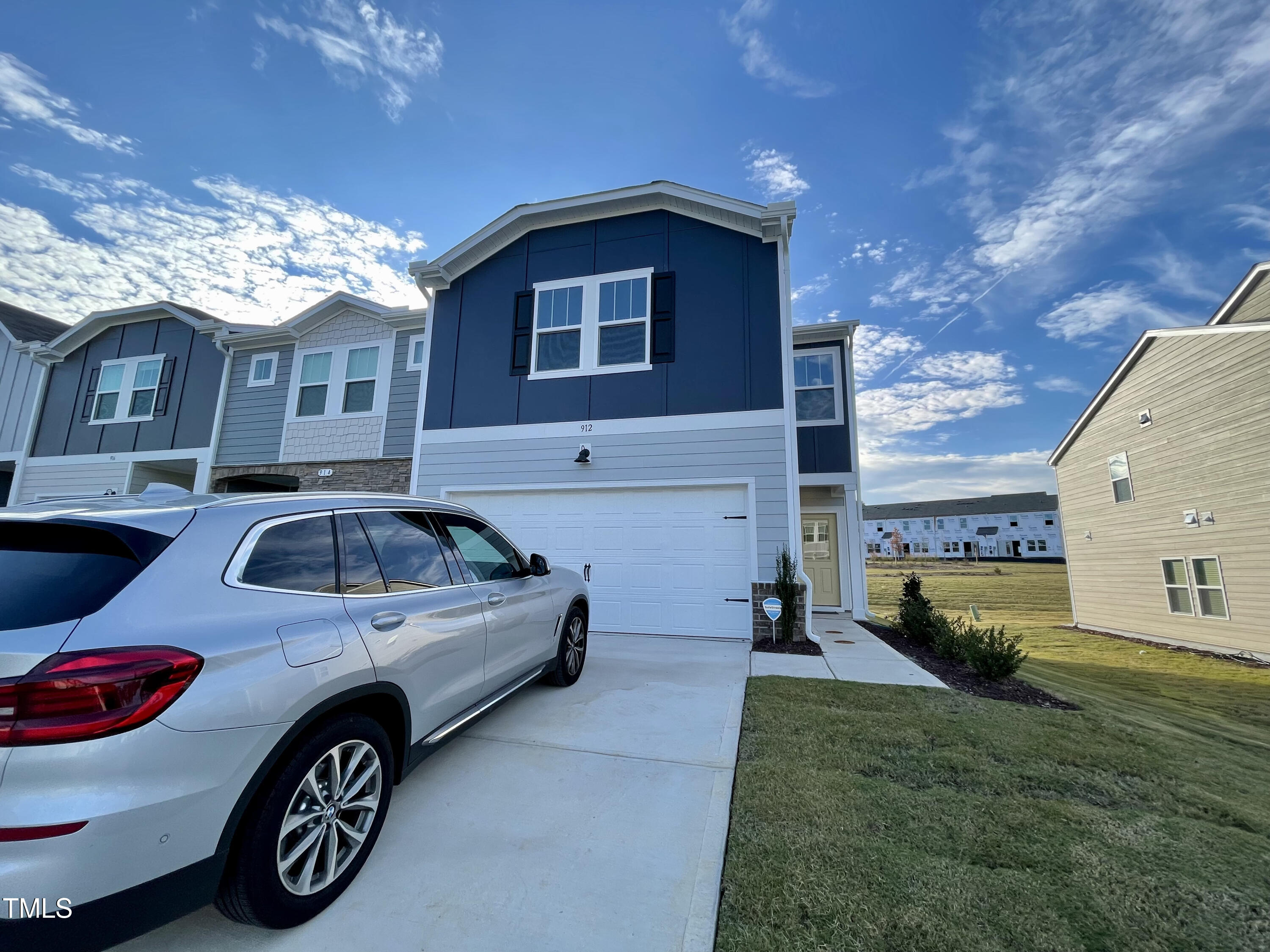 a view of a car parked in front of a house