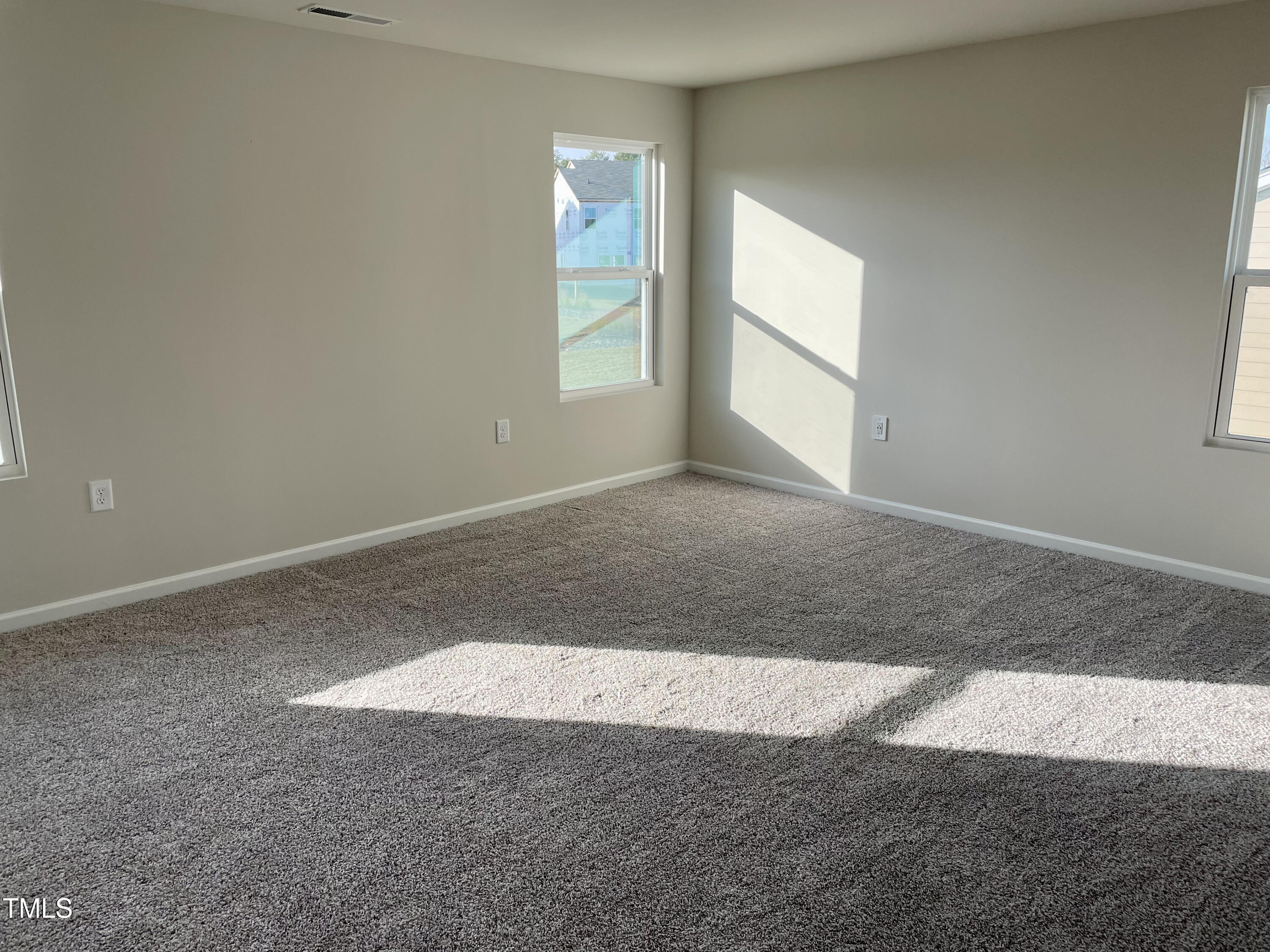 912 Field Ivy Drive Fuquay-Varina, NC 27526 - Photo 12 of 27 an empty room with windows