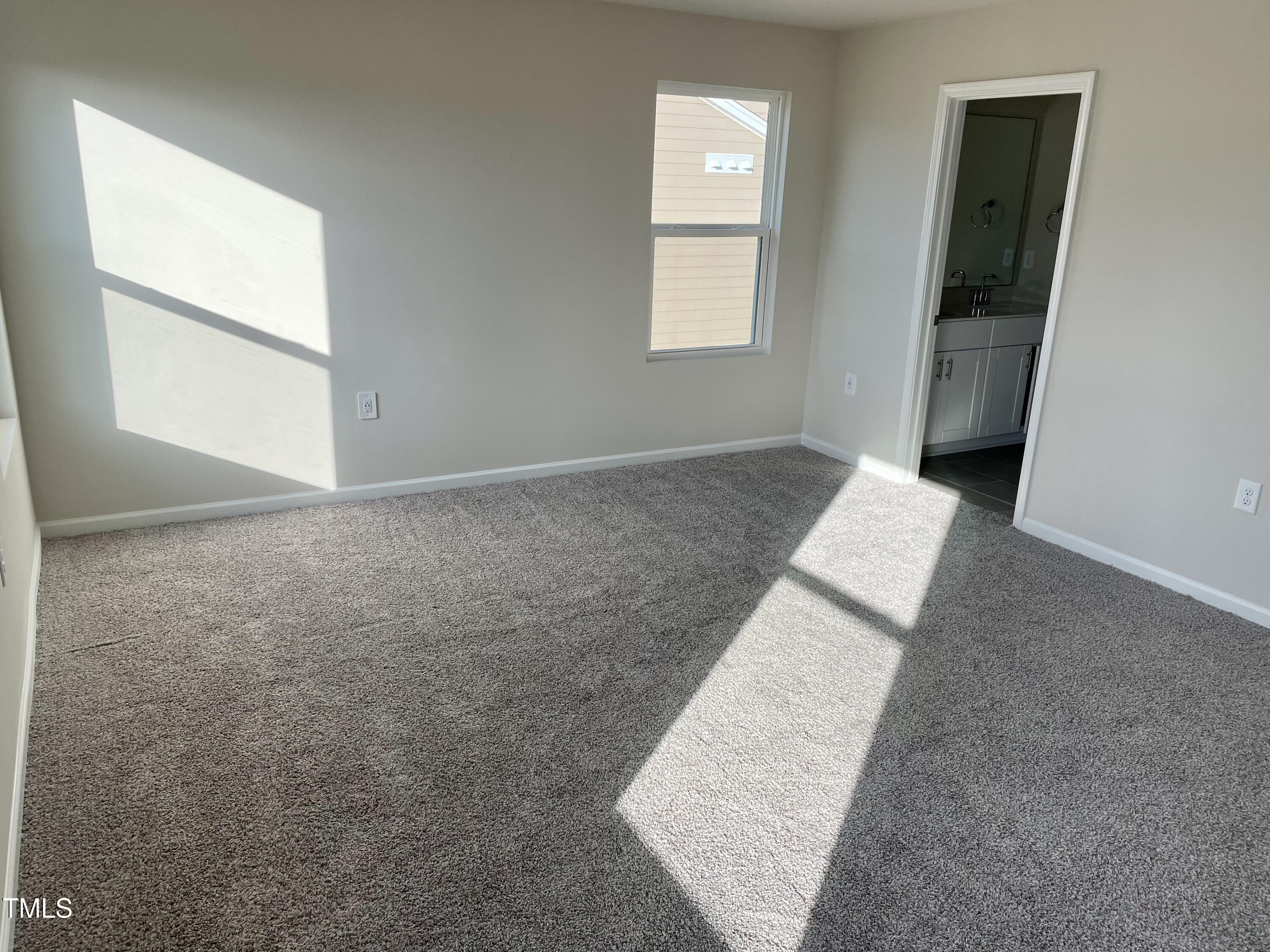 912 Field Ivy Drive Fuquay-Varina, NC 27526 - Photo 13 of 27 an empty room with windows