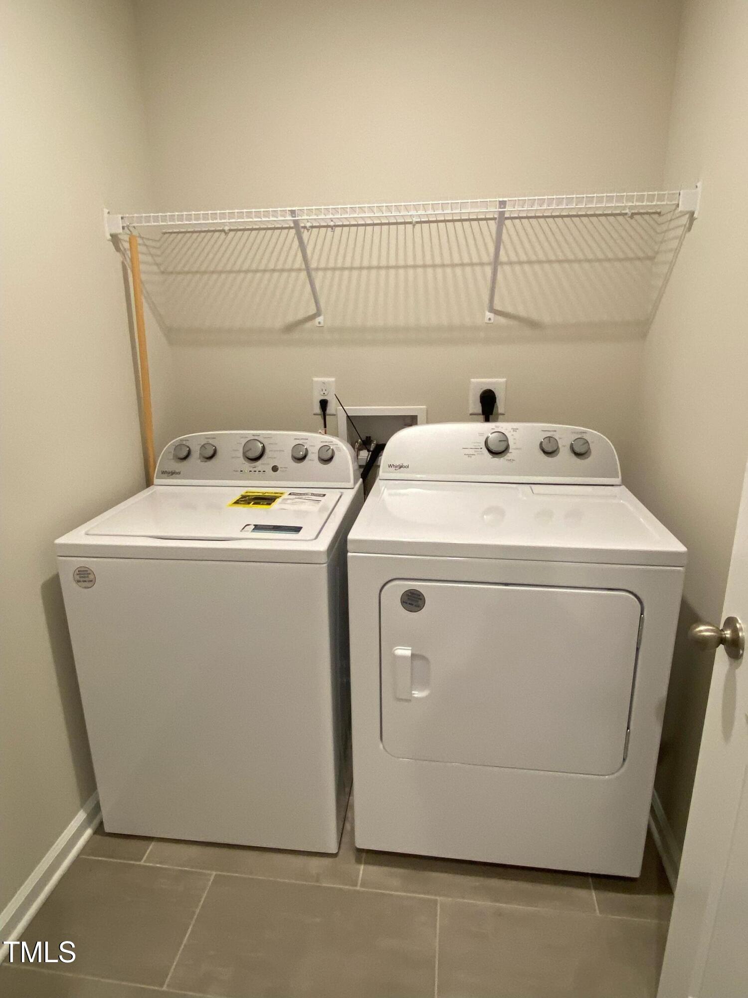 912 Field Ivy Drive Fuquay-Varina, NC 27526 - Photo 16 of 27 a utility room with dryer and washer