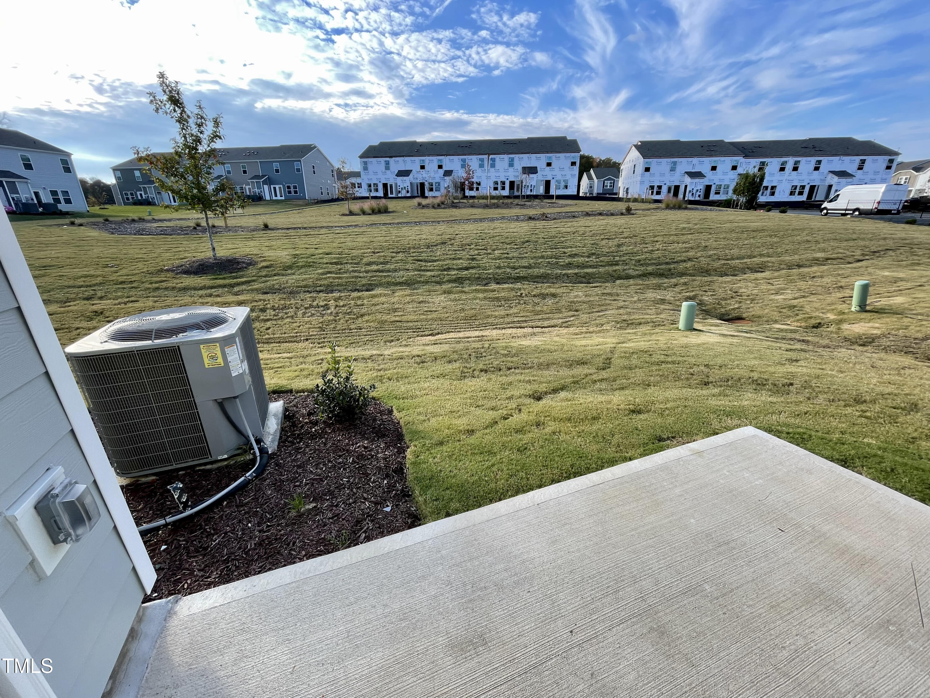 912 Field Ivy Drive Fuquay-Varina, NC 27526 - Photo 17 of 27 a view of a lake with a building in the background