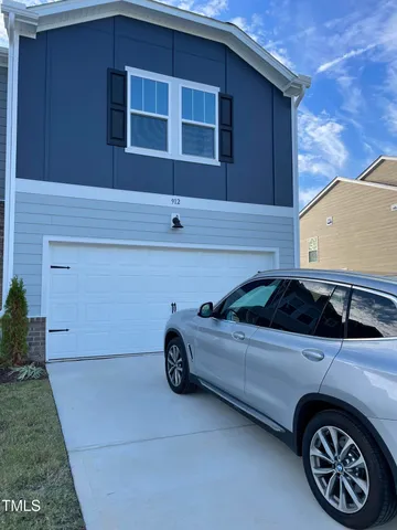 a car parked in front of a house