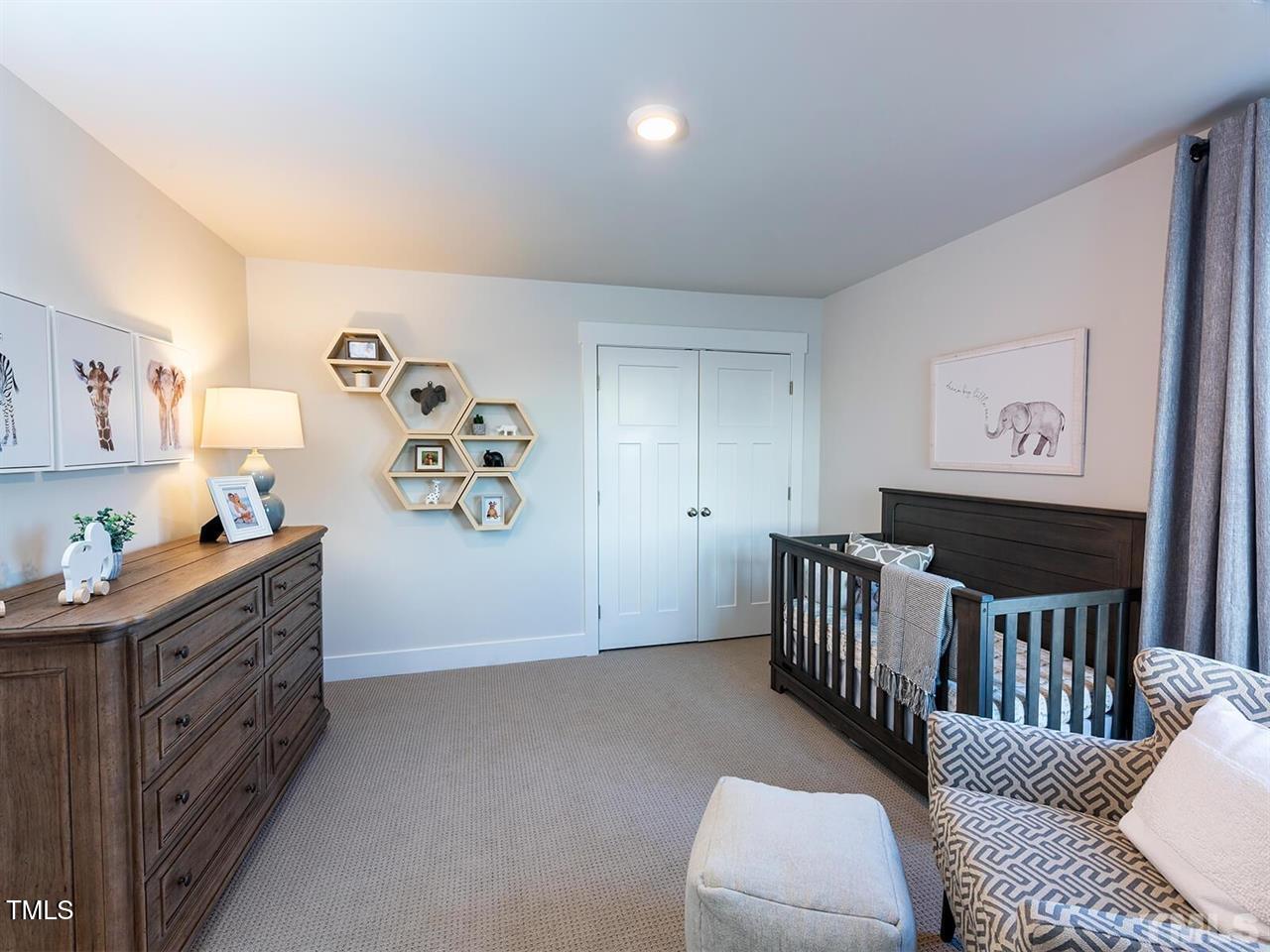 912 Field Ivy Drive Fuquay-Varina, NC 27526 - Photo 26 of 27 a bedroom with furniture and a window