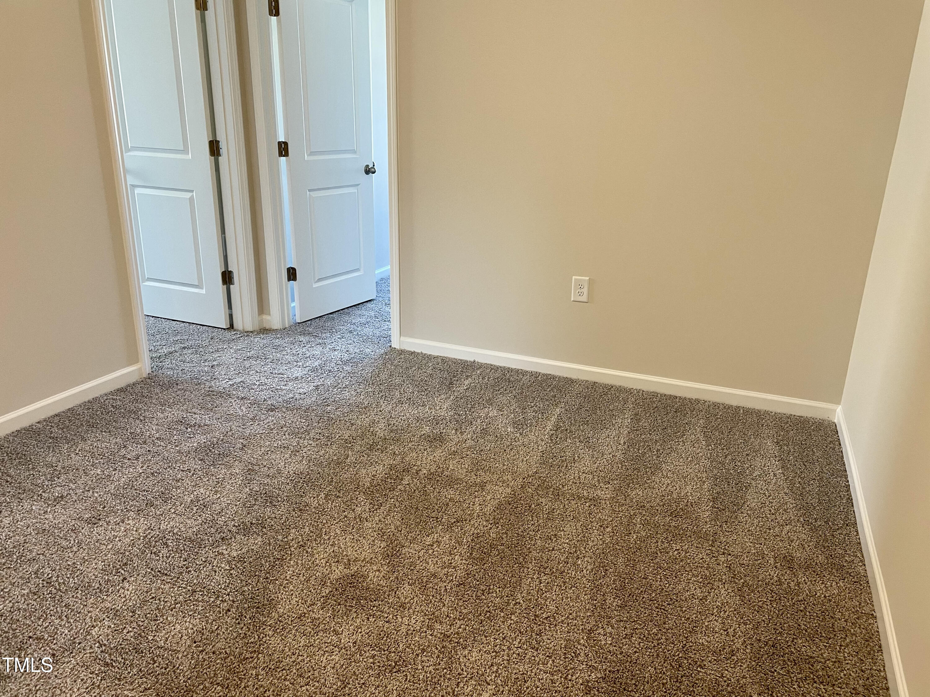 912 Field Ivy Drive Fuquay-Varina, NC 27526 - Photo 8 of 27 an empty room with closet area