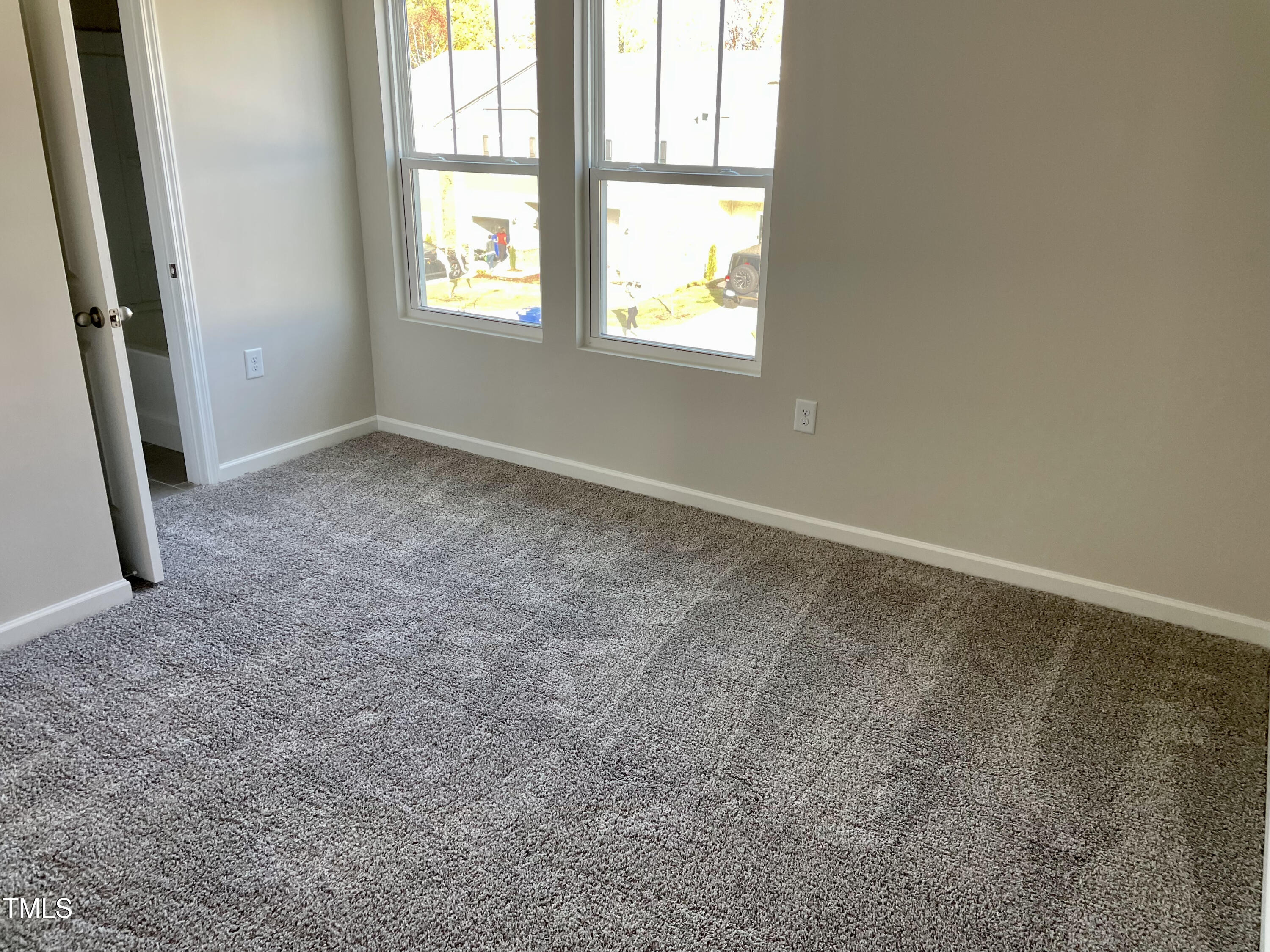 912 Field Ivy Drive Fuquay-Varina, NC 27526 - Photo 9 of 27 an empty room with windows