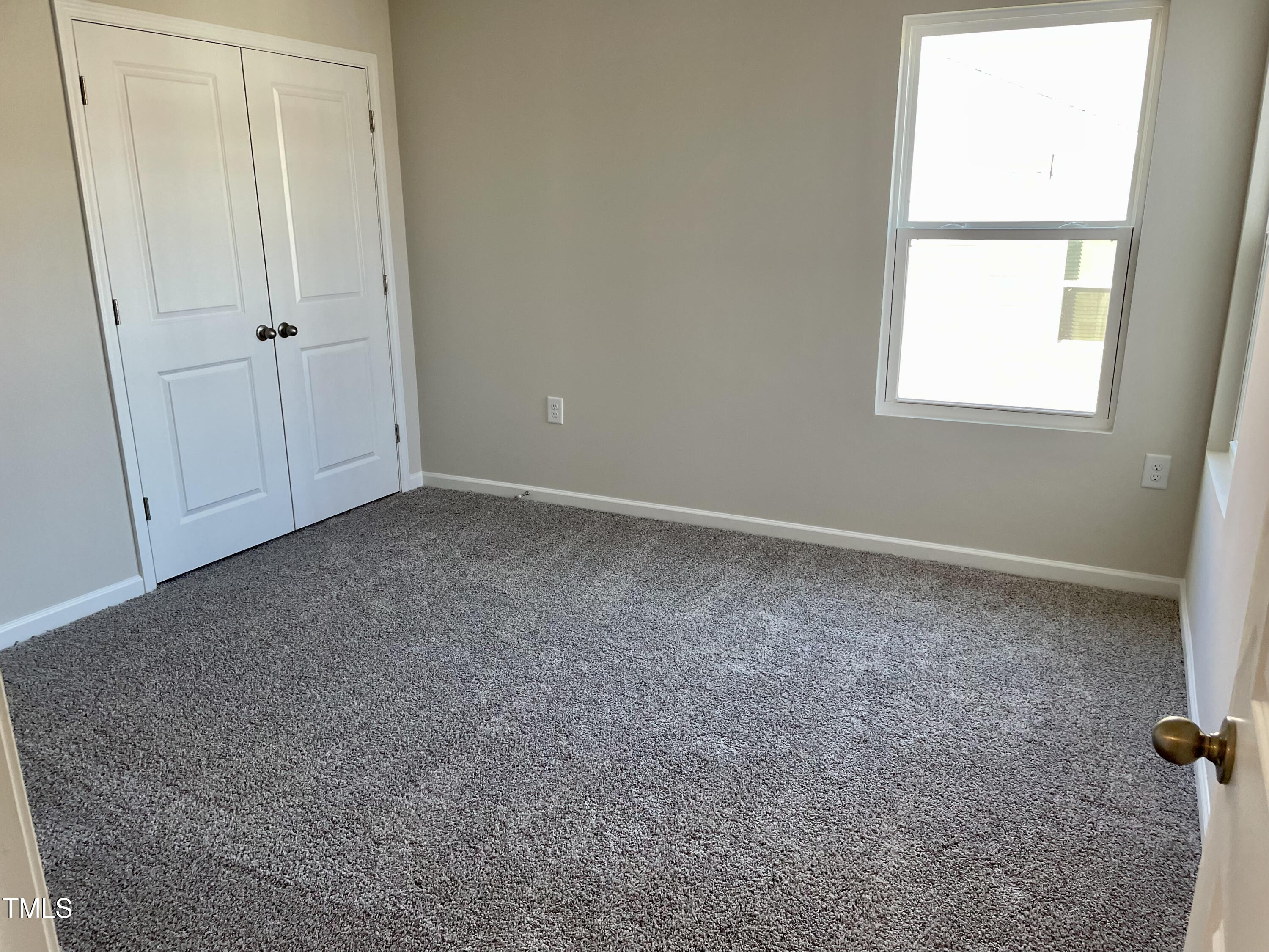 912 Field Ivy Drive Fuquay-Varina, NC 27526 - Photo 10 of 27 an empty room with windows