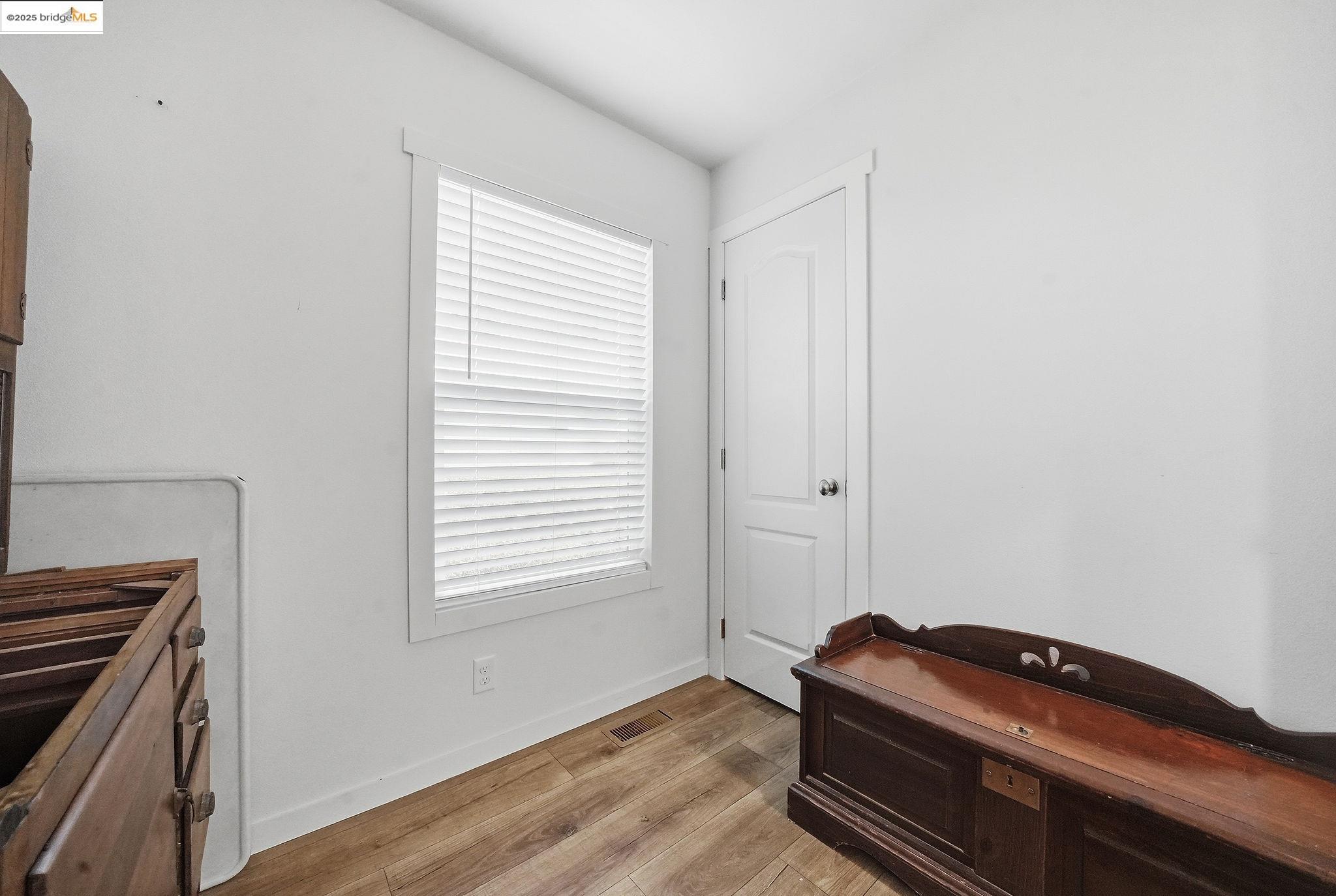 150 Clinton Road Jackson, CA 95642 - Photo 34 of 44 Bedroom featuring light wood-style floors and baseboards