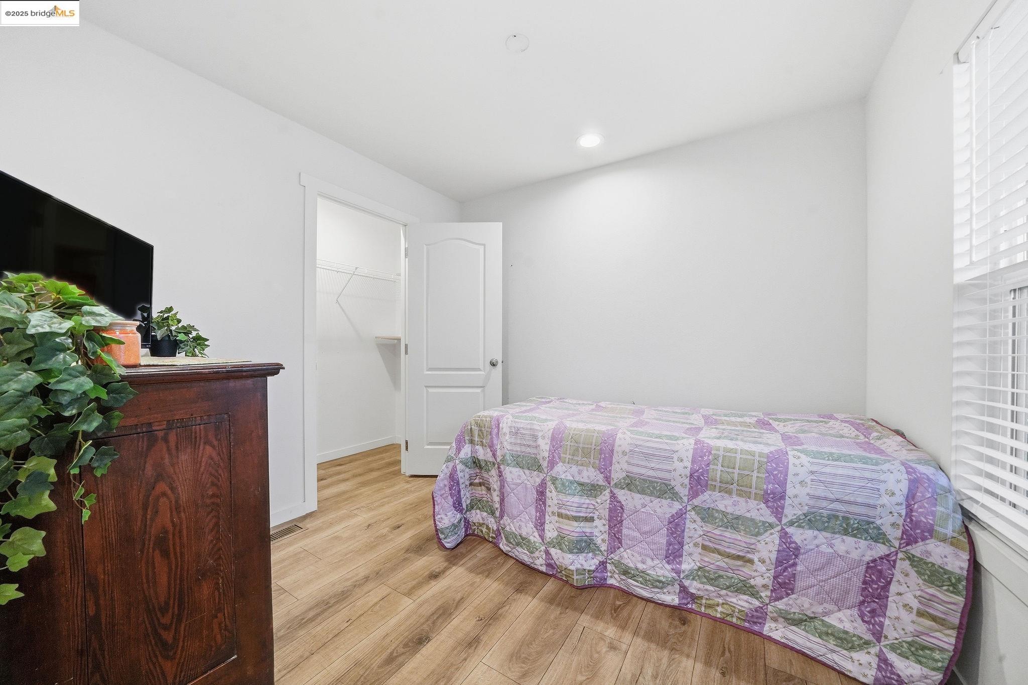 150 Clinton Road Jackson, CA 95642 - Photo 35 of 44 Bedroom with light wood finished floors, a walk in closet, and recessed lighting