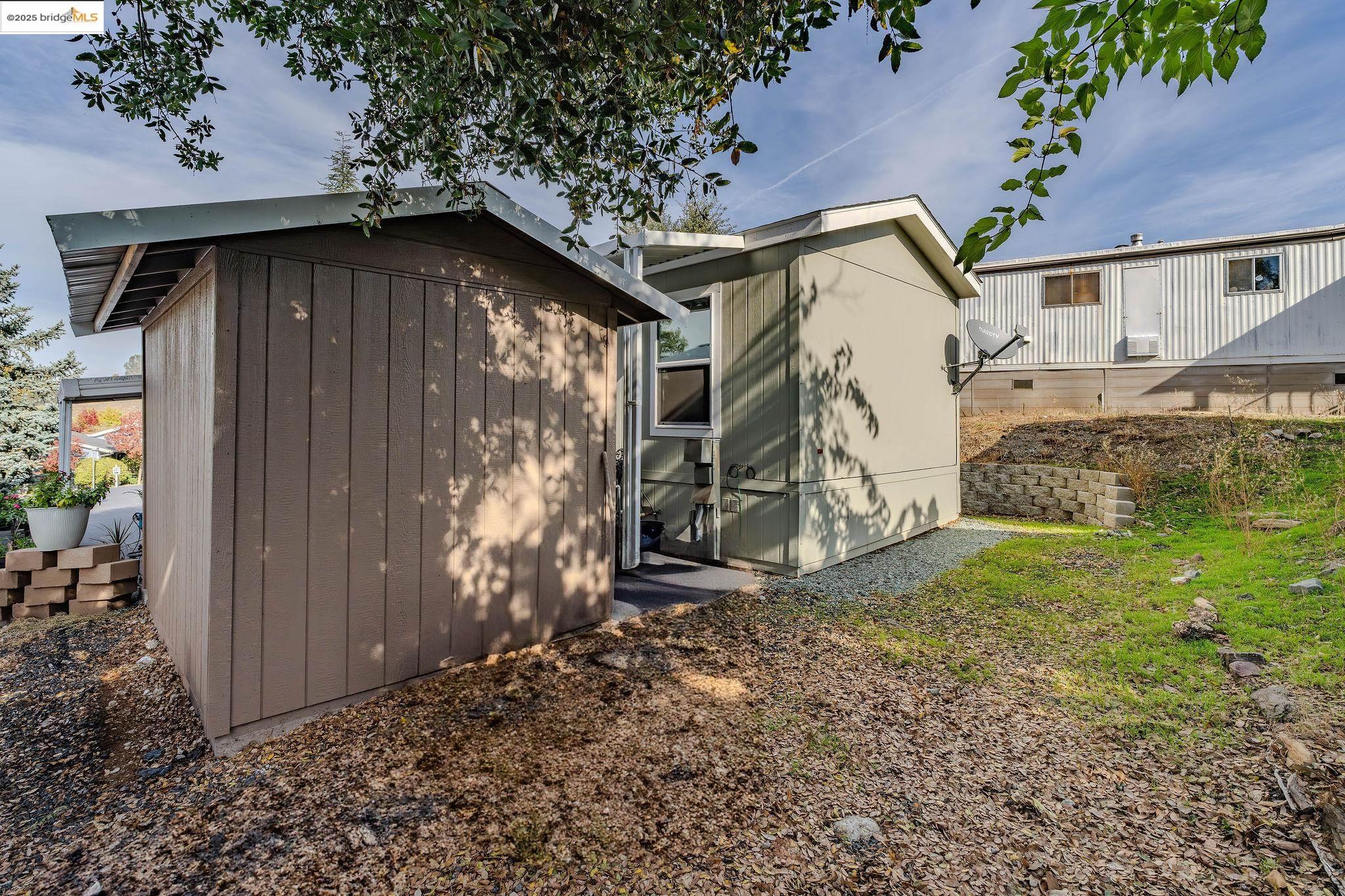 150 Clinton Road Jackson, CA 95642 - Photo 40 of 44 Back of property featuring a storage shed