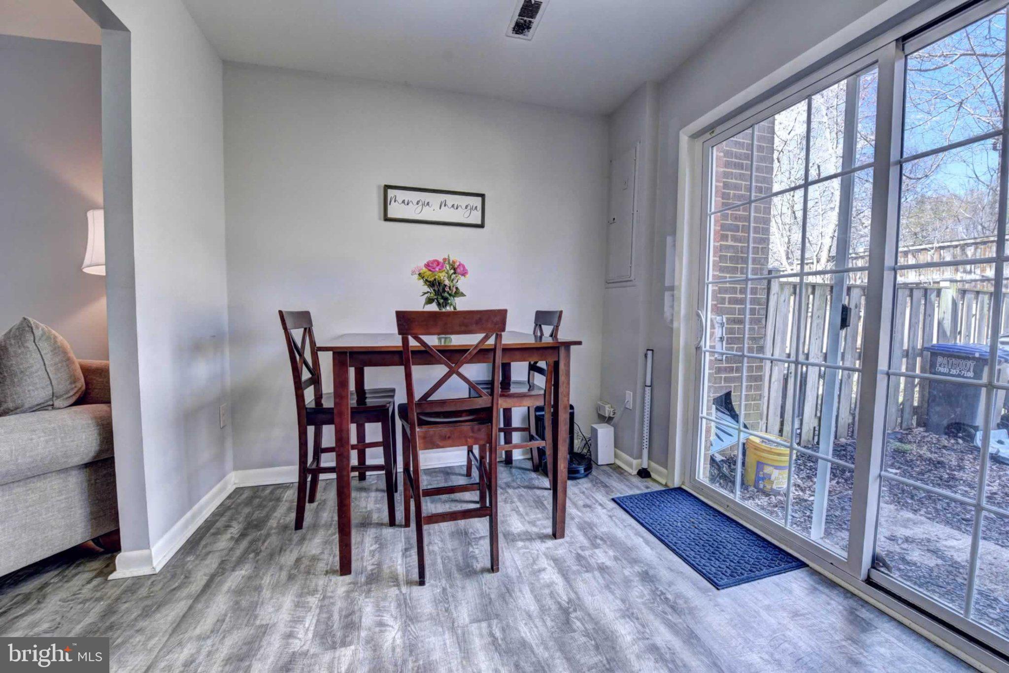 2226 Gunsmith Square Reston, VA 20191 - Photo 10 of 35 a dining room with furniture and wooden floor