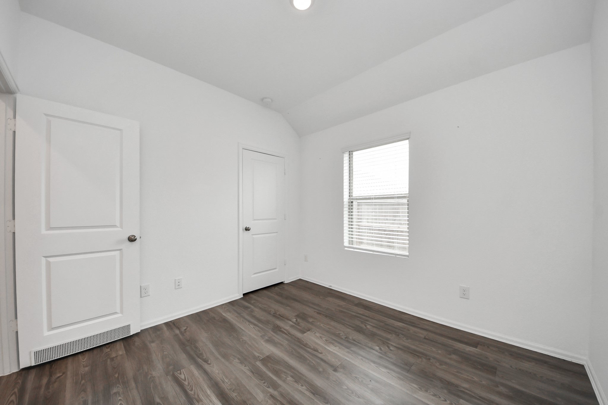 14230 Elrington Holw Trail Rosharon, TX 77583 - Photo 23 of 42 a view of an empty room with wooden floor and a window