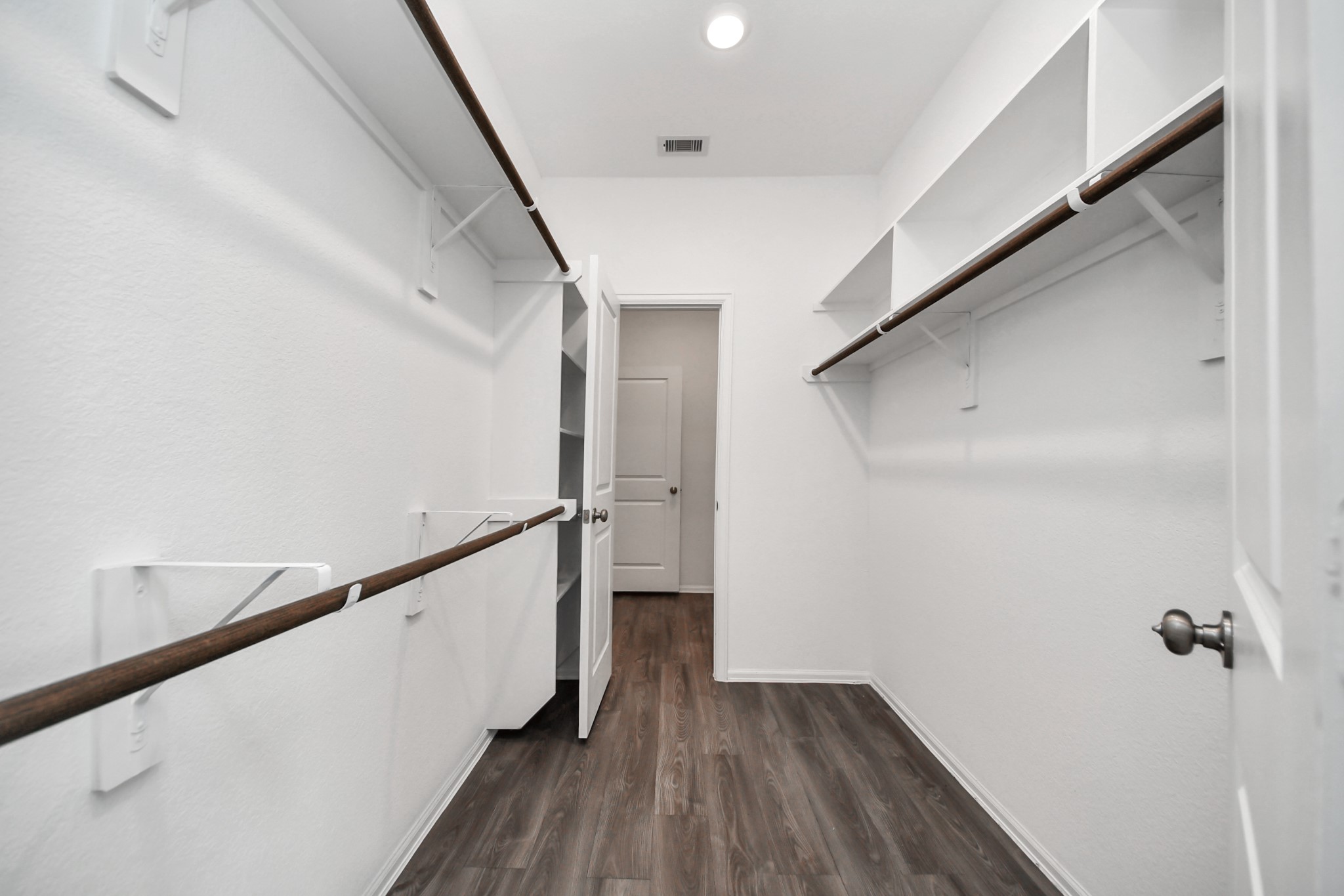 14230 Elrington Holw Trail Rosharon, TX 77583 - Photo 32 of 42 a view of a hallway with wooden floor and staircase