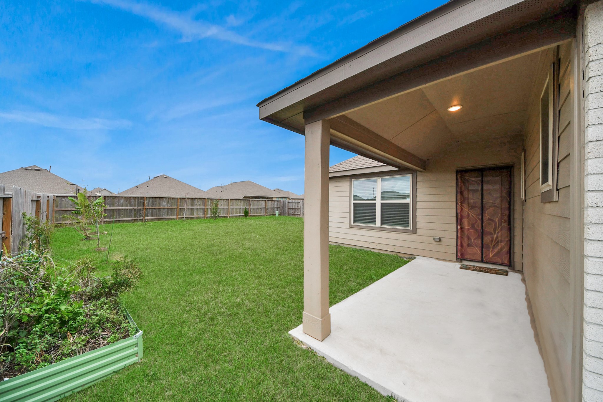 14230 Elrington Holw Trail Rosharon, TX 77583 - Photo 38 of 42 a front view of a house with garden