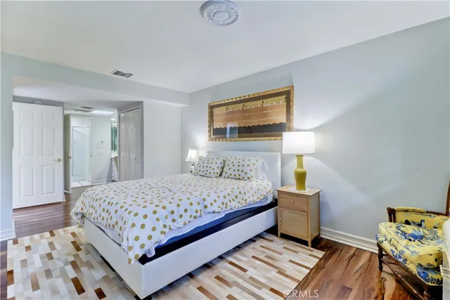 a bathroom with a sink vanity granite shower and a mirror
