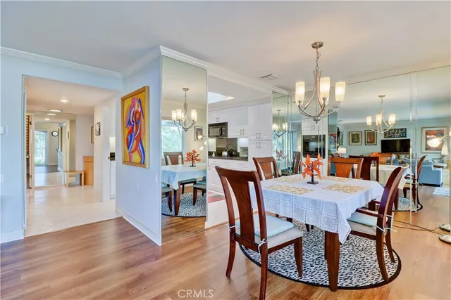 a view of a dining room and livingroom with furniture