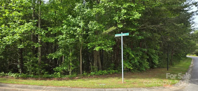 a backyard of a house with lots of plants