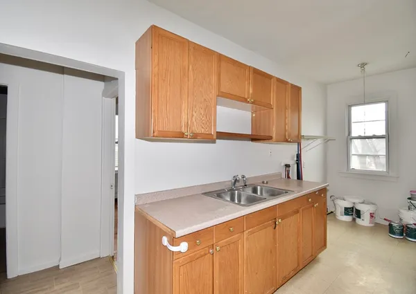 a bathroom with a sink double vanity and a mirror