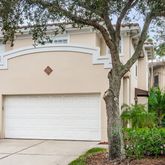 a house with a tree in front of it