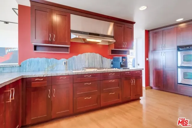 a bedroom with a bed and large window