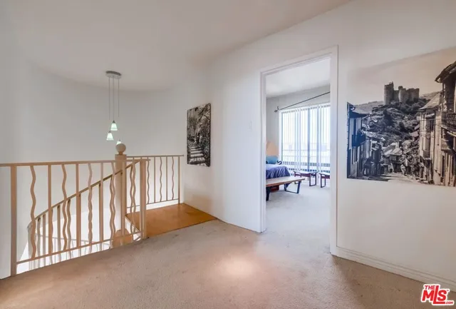 a bedroom with a bed and dresser