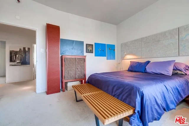 a room with lots of chairs and mirrors