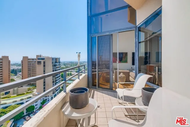 a living room with fireplace furniture and a table