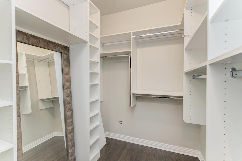 512 North Peoria Street Chicago, IL 60642 - Photo 21 of 32 a view of walk in closet with empty racks