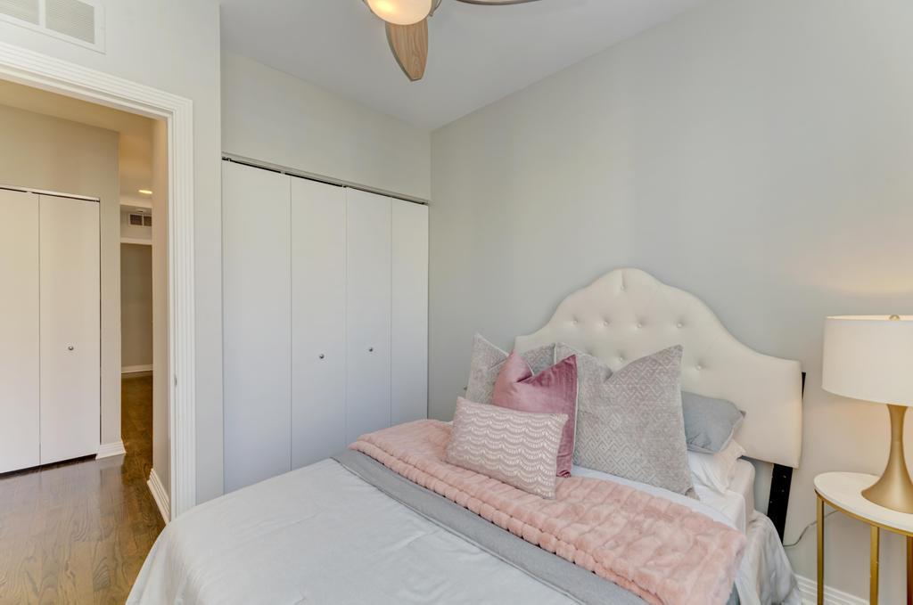 512 North Peoria Street Chicago, IL 60642 - Photo 26 of 32 a bedroom with a bed and a table in it