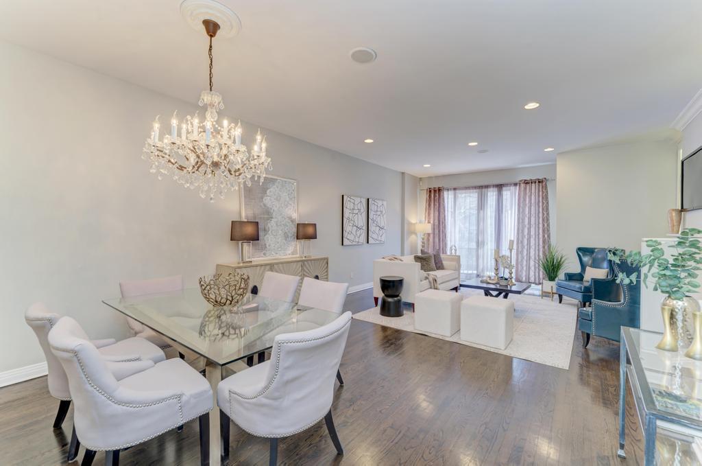 512 North Peoria Street Chicago, IL 60642 - Photo 10 of 32 a view of a dining room with furniture wooden floor and chandelier