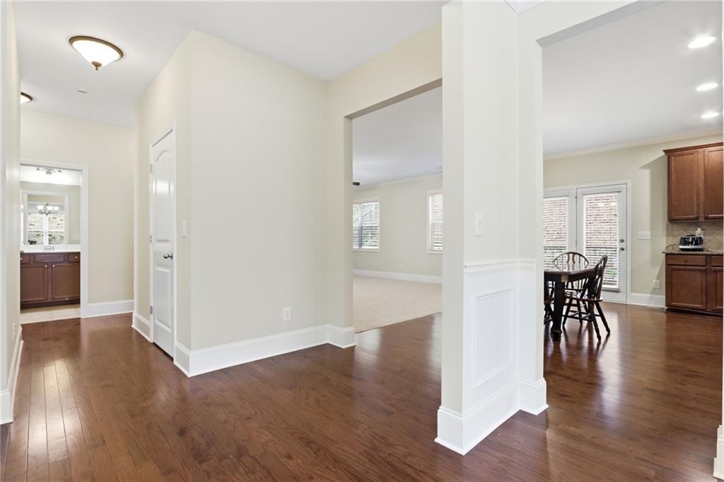 1515 Riva Ridge Suwanee, GA 30024 - Photo 7 of 35 a view of a dining area with hardwood floor and a kitchen